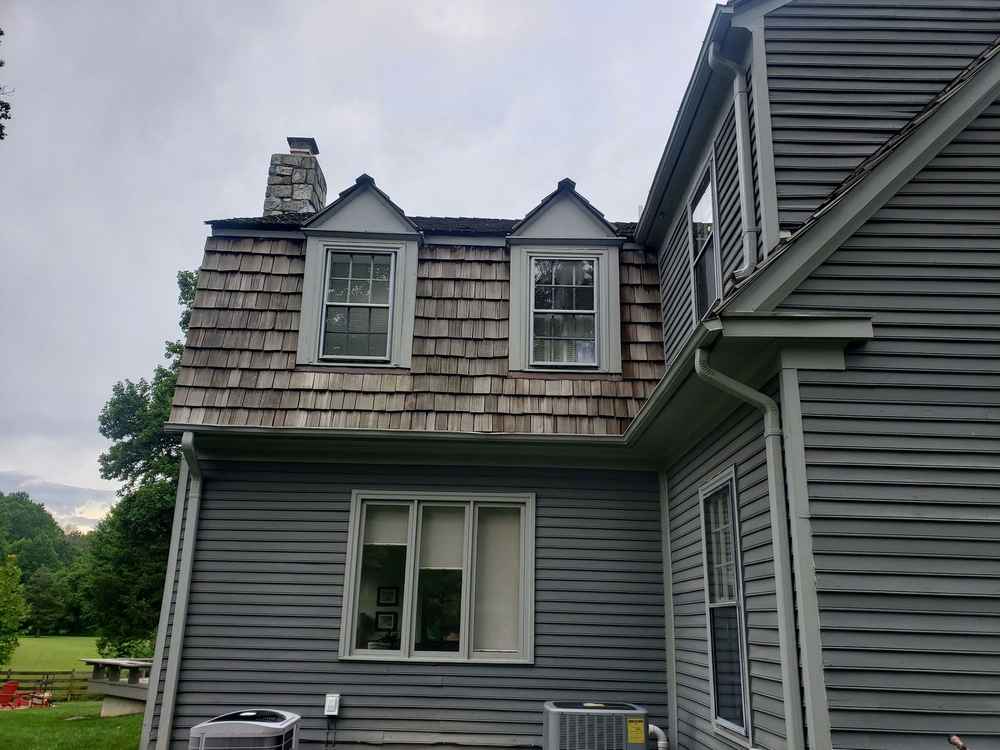 James Hardie gray fiber cement siding on a home with two dormers.